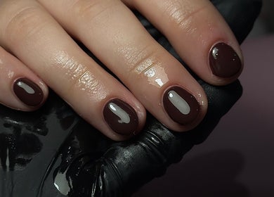 Stylish dark polished nails at ER Nails, Worsley, England, GB. Perfect manicure for modern elegance.