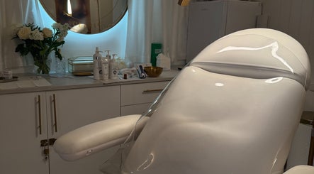Treatment room at The Orielle Clinic, Edinburgh, Scotland, GB featuring a plush treatment chair and modern decor.