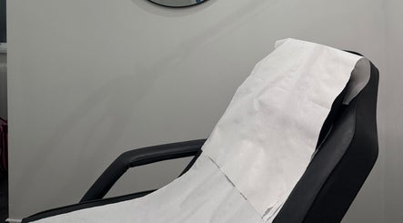 Relaxing treatment chair at The Orielle Clinic (Bathgate), Bathgate, Scotland, GB, ready for client comfort.