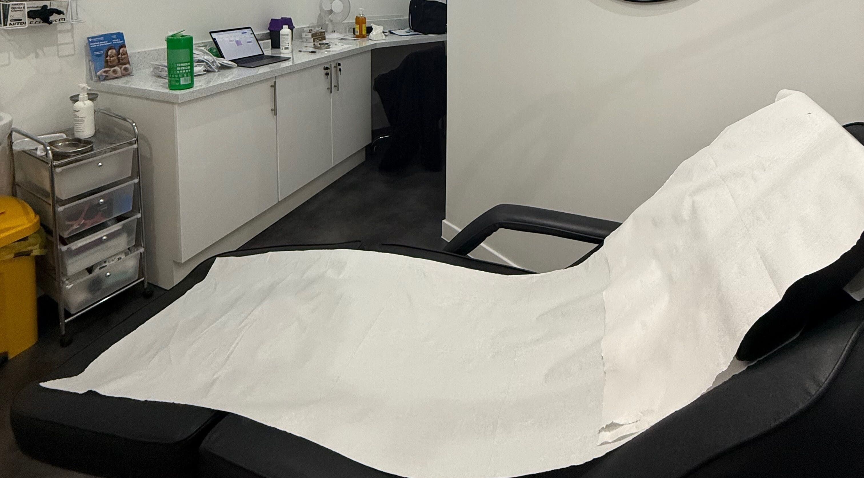 Relaxing treatment room at The Orielle Clinic (Bathgate), Bathgate, Scotland, GB. Features a comfortable treatment bed.