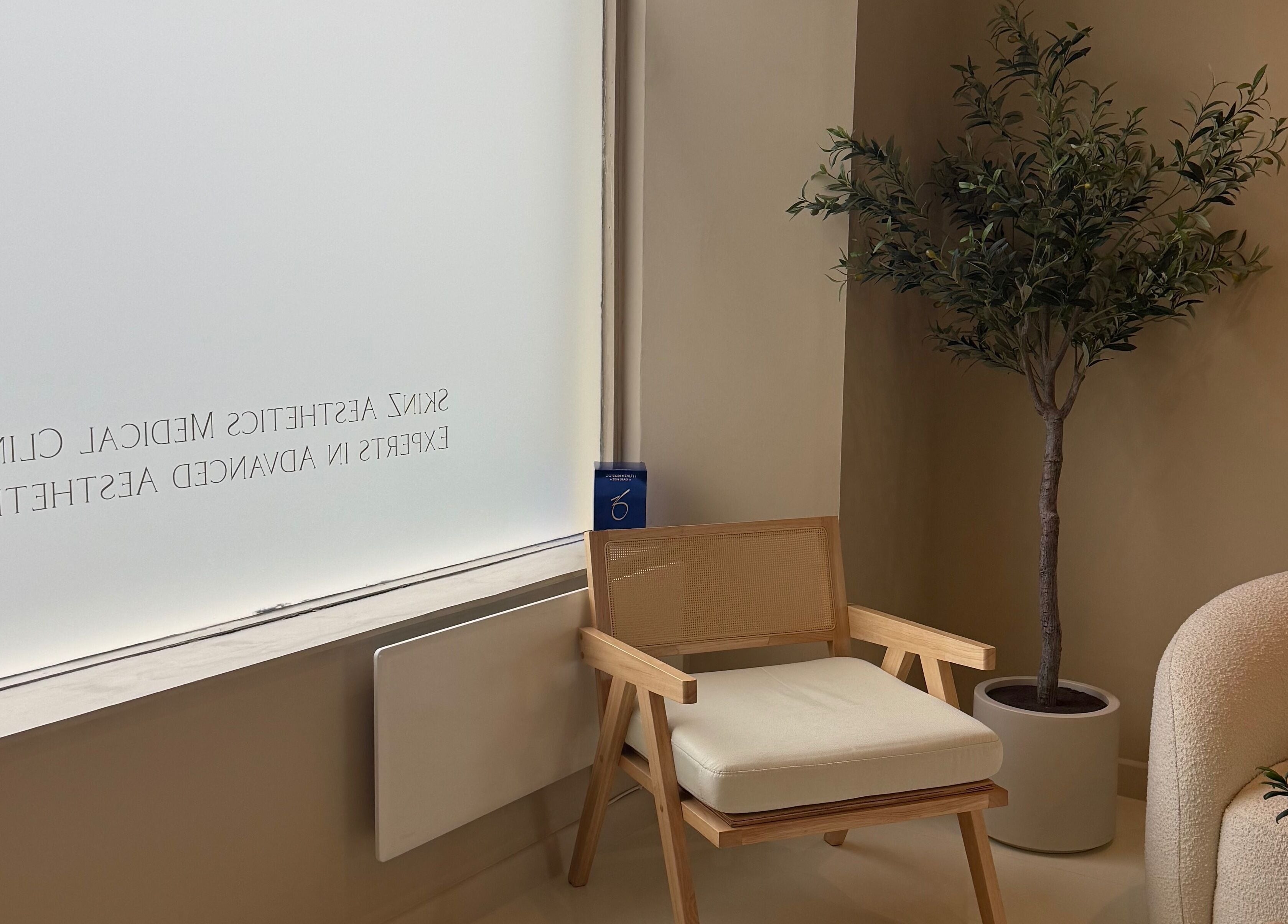 Serene waiting area at The Orielle Clinic, Clarkston, Scotland, GB with soft seating and greenery.