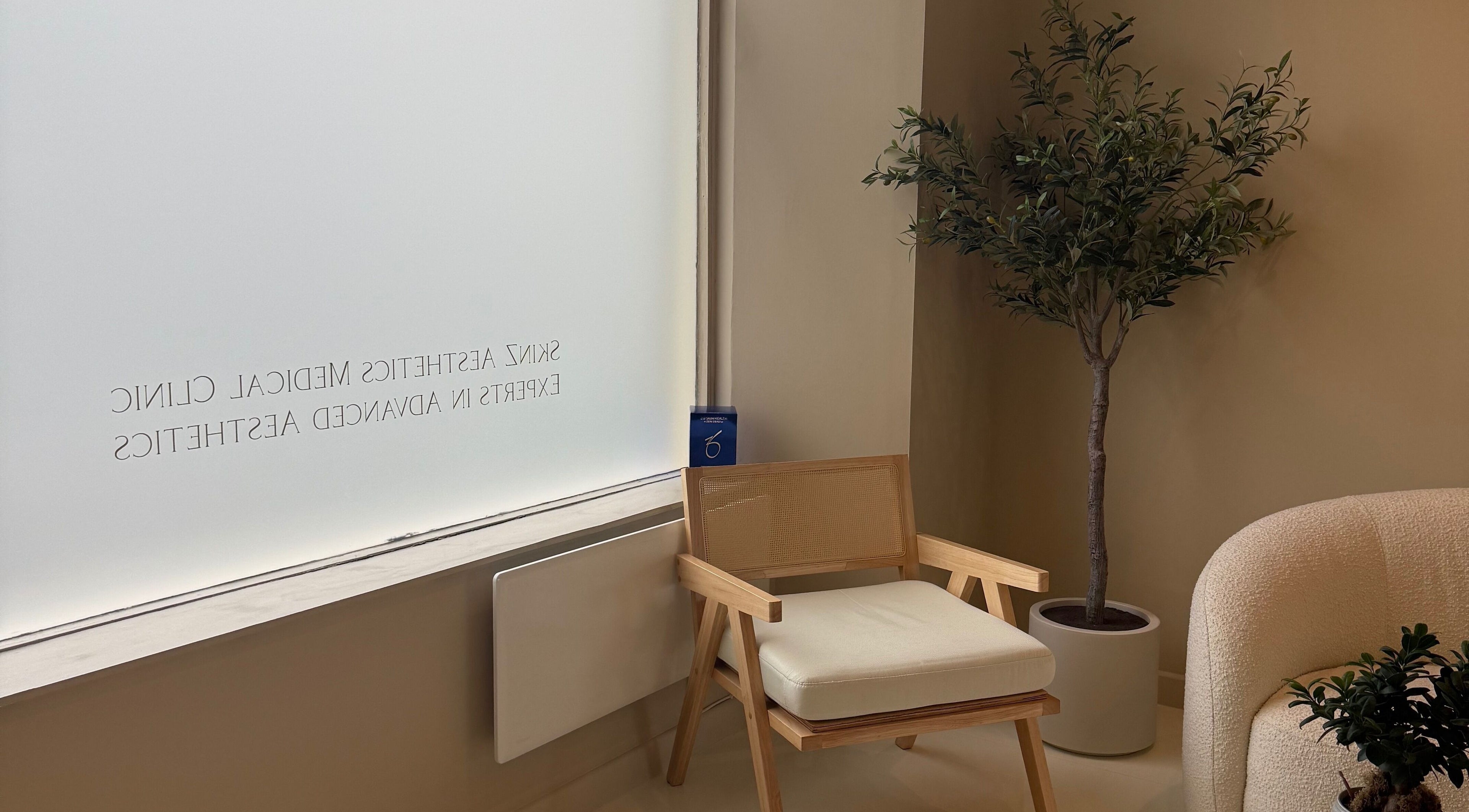 Serene waiting area at The Orielle Clinic, Clarkston, Scotland, GB with soft seating and greenery.