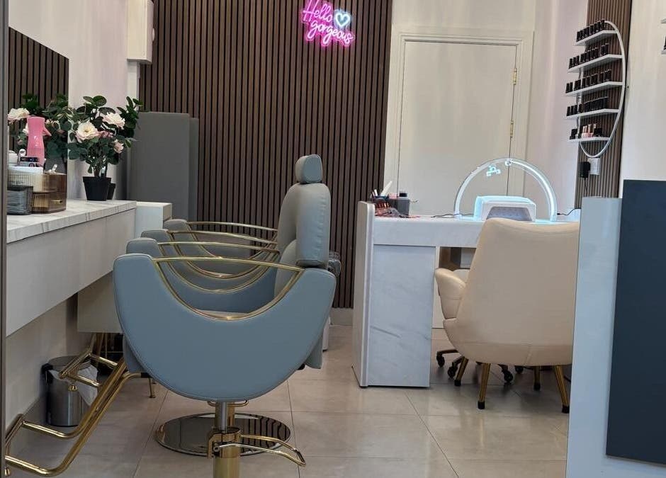Modern salon interior at Nail & Brow Bar Mullingar, Mullingar, IE, featuring chic chairs and stylish decor.