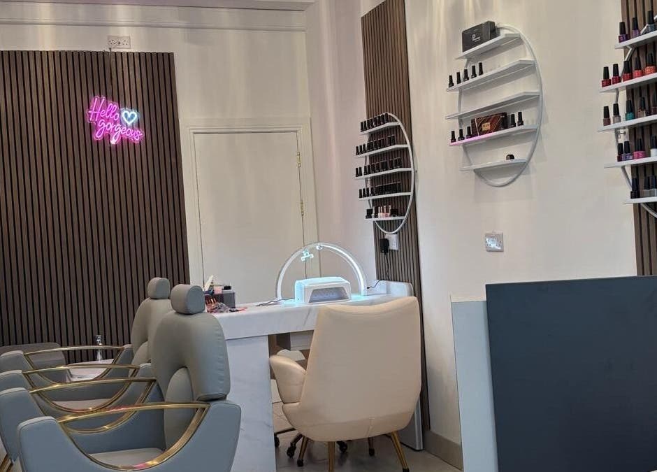 Stylish interior of Nail & Brow Bar Mullingar, Mullingar, IE with elegant chairs and nail polish display.