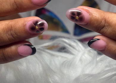 Close-up of elegant floral nail art at TayTips, Montego Bay, St. James Parish, JM.