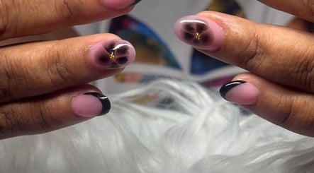 Close-up of elegant floral nail art at TayTips, Montego Bay, St. James Parish, JM.