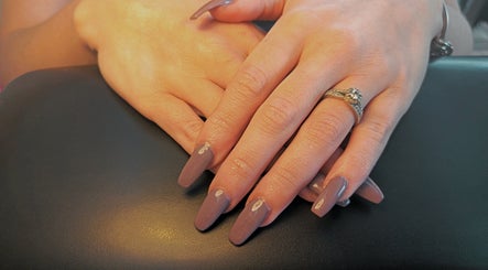 Elegant manicured hands with ring at Cute-Icles, Boksburg, Gauteng, ZA showcasing stylish nail design.