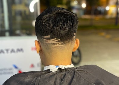 Modern haircut design at JL BARBER-TATTOO STUDIO in Ate, Provincia De Lima, PE, showcasing expert precision.