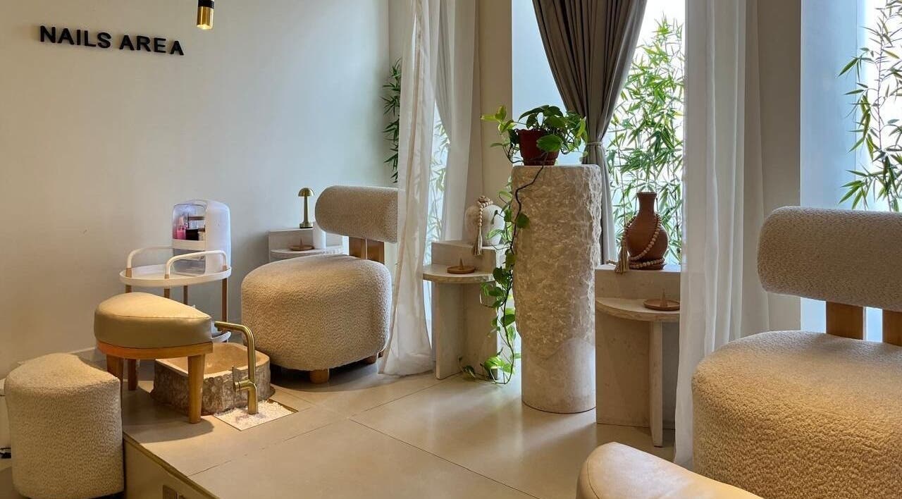 Nail area interior at Wana Center | صالون وانـا in Riyadh, Riyadh Province, SA with elegant seating and decor.