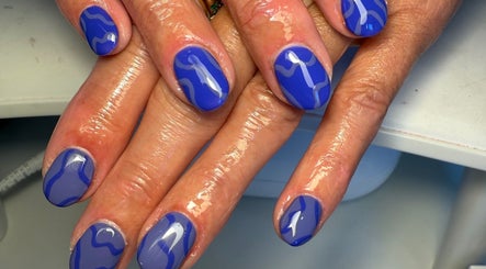 Blue wave nail art design at Daisie Mae Beauty in Lechlade, England, GB, showcasing glossy style.