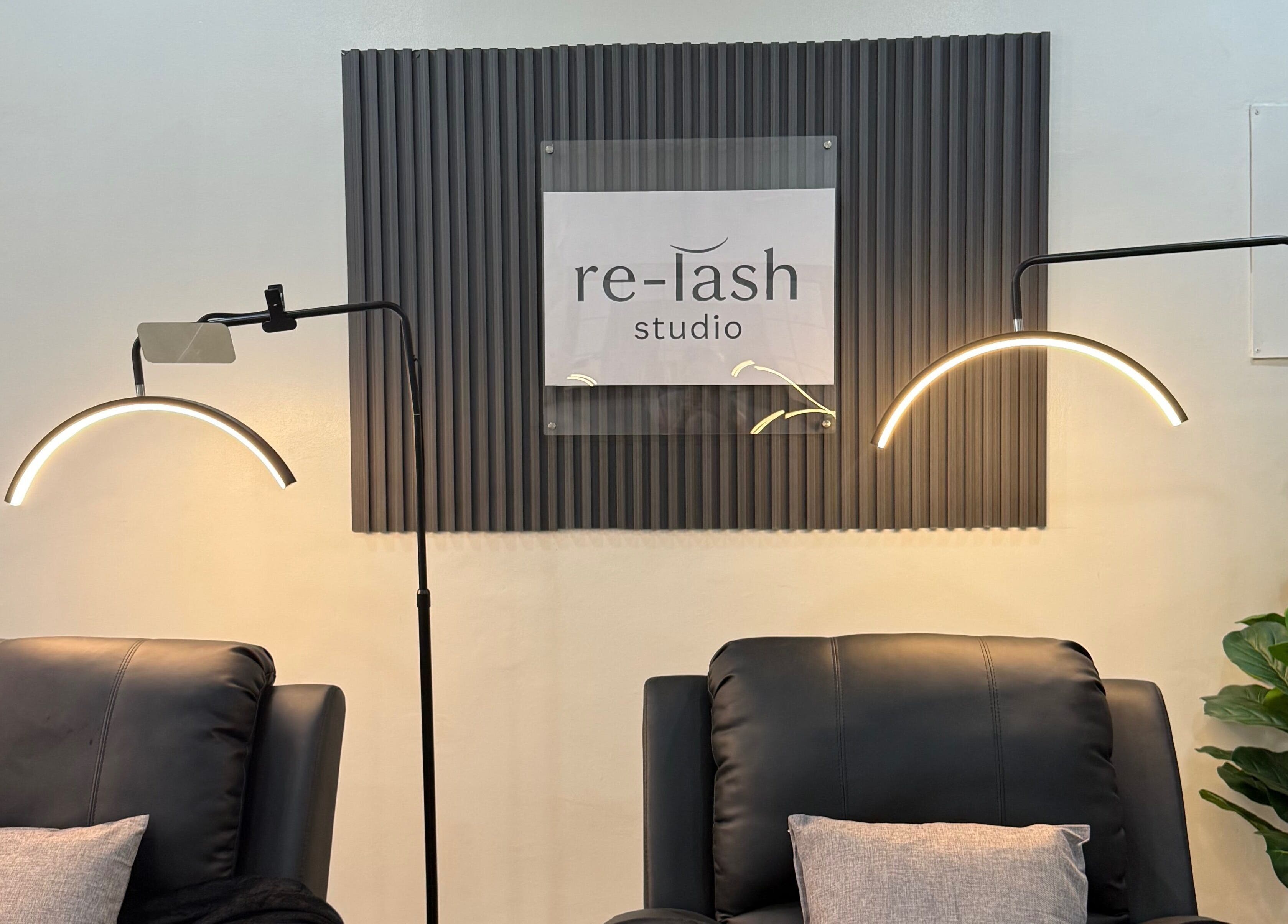Relaxing chairs in Relash Eyelash Studio, Quezon City, Metro Manila, PH with elegant lighting.