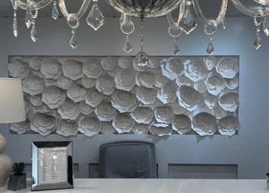 Elegant reception area at Lash Studio, Barnstable, Massachusetts, US, featuring intricate rose wall art.