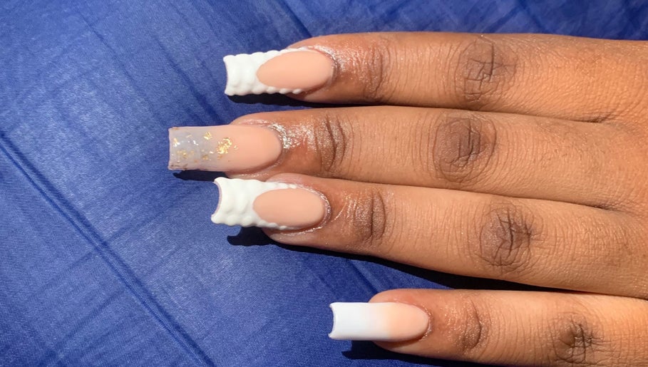 Elegant nail design at August Nails, Lusaka, Lusaka Province, ZM. Features unique white and nude patterns.