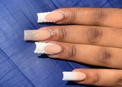 Elegant nail design at August Nails, Lusaka, Lusaka Province, ZM. Features unique white and nude patterns.