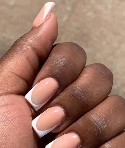 Elegant French manicure at August Nails, Lusaka, Lusaka Province, ZM. Perfectly groomed nails with a chic style.