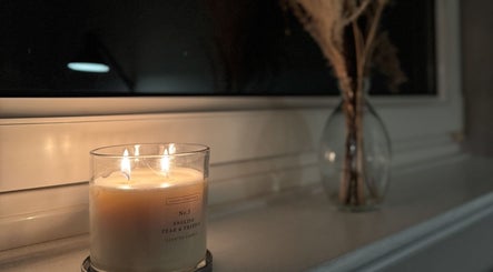 Warm candlelight ambiance at Pretty Little Nails, Reigate, England, GB.