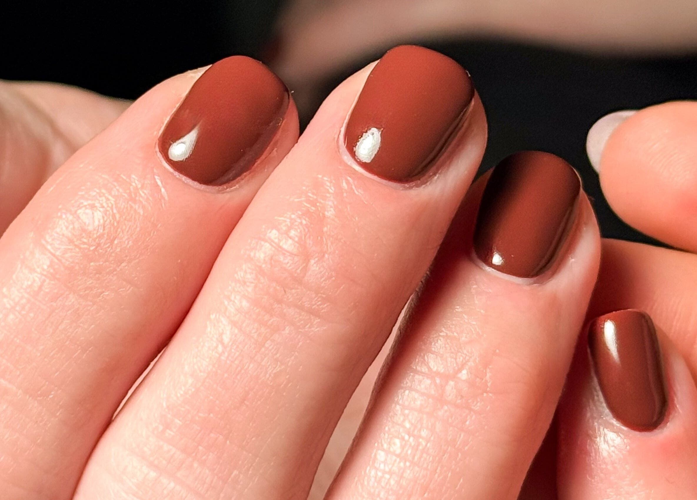Gorgeous almond brown nails at Pretty Little Nails, Reigate, England, GB, showcasing expert nail artistry.