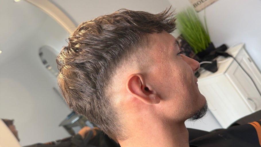 Stylish haircut for men at Beau Brims, Copthorne, England, GB showcasing modern grooming.