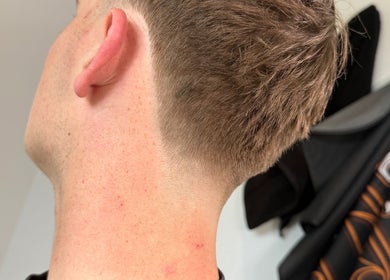 Close-up of a fresh haircut at Beau Brims, Copthorne, England, GB showcasing clean hairline details.