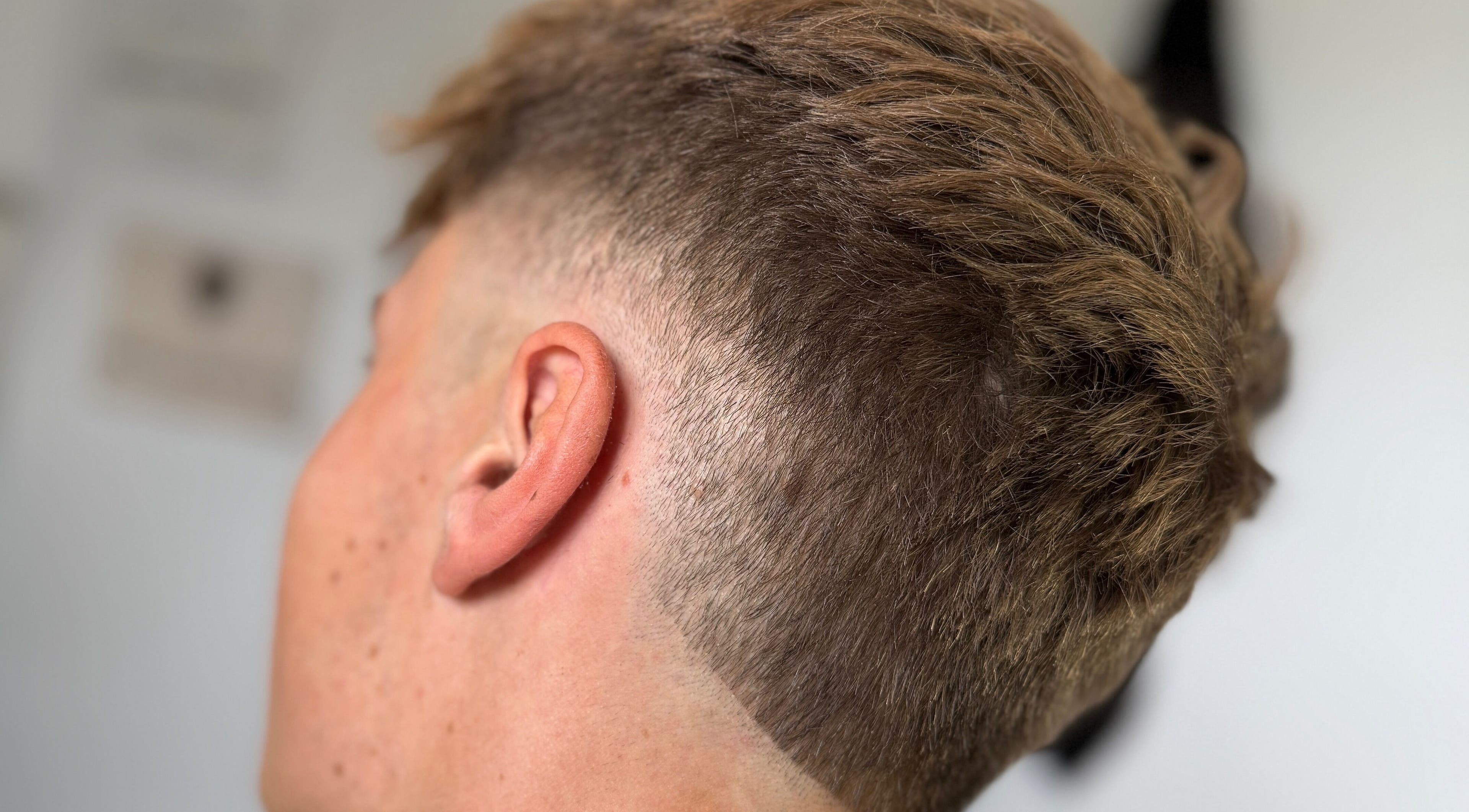 Close-up of sleek fade haircut at Beau Brims, Copthorne, England, GB highlighting precision and style.