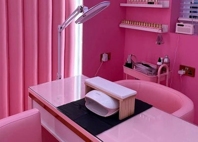 Elegant pink-themed beauty station at byhollymay, Conisbrough, England, GB, perfect for relaxing treatments.