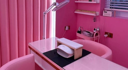 Elegant pink-themed beauty station at byhollymay, Conisbrough, England, GB, perfect for relaxing treatments.