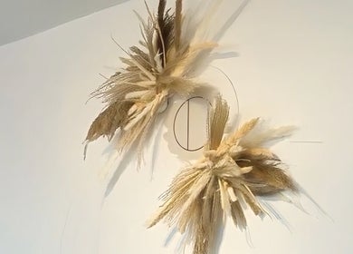 Chic dried floral decor at HairByMadi in Bradford, England, GB elevates the salon's serene aesthetic.