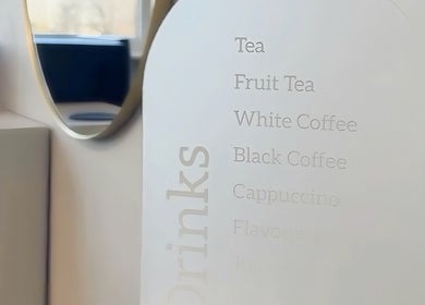 Elegant drink menu at HairByMadi, Bradford, England, GB, offering tea, coffee, and cappuccino options.