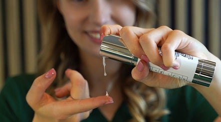 Person applying skincare serum at MC BeautyHouse, Kilcullen, County Kildare, IE.