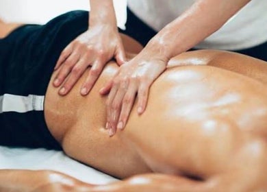 Therapist performs massage at Ryan Moir Sports Therapy in Westfield, England, GB, enhancing muscle recovery.