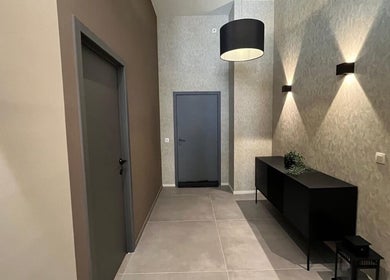 Sophisticated entryway at Cmj Health Care & Beauty in Bruxelles, Bruxelles, BE with modern lighting and decor.