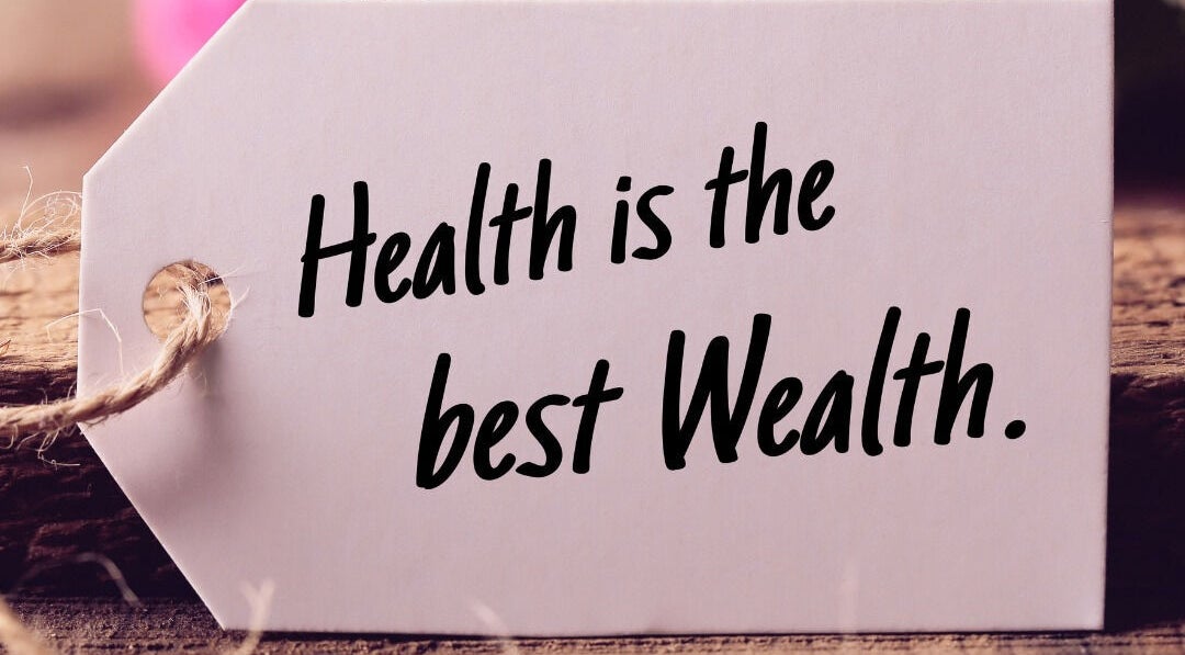 Inspirational quote 'Health is the best wealth' on a tag at Coach Howard, Orlando, Florida, US.