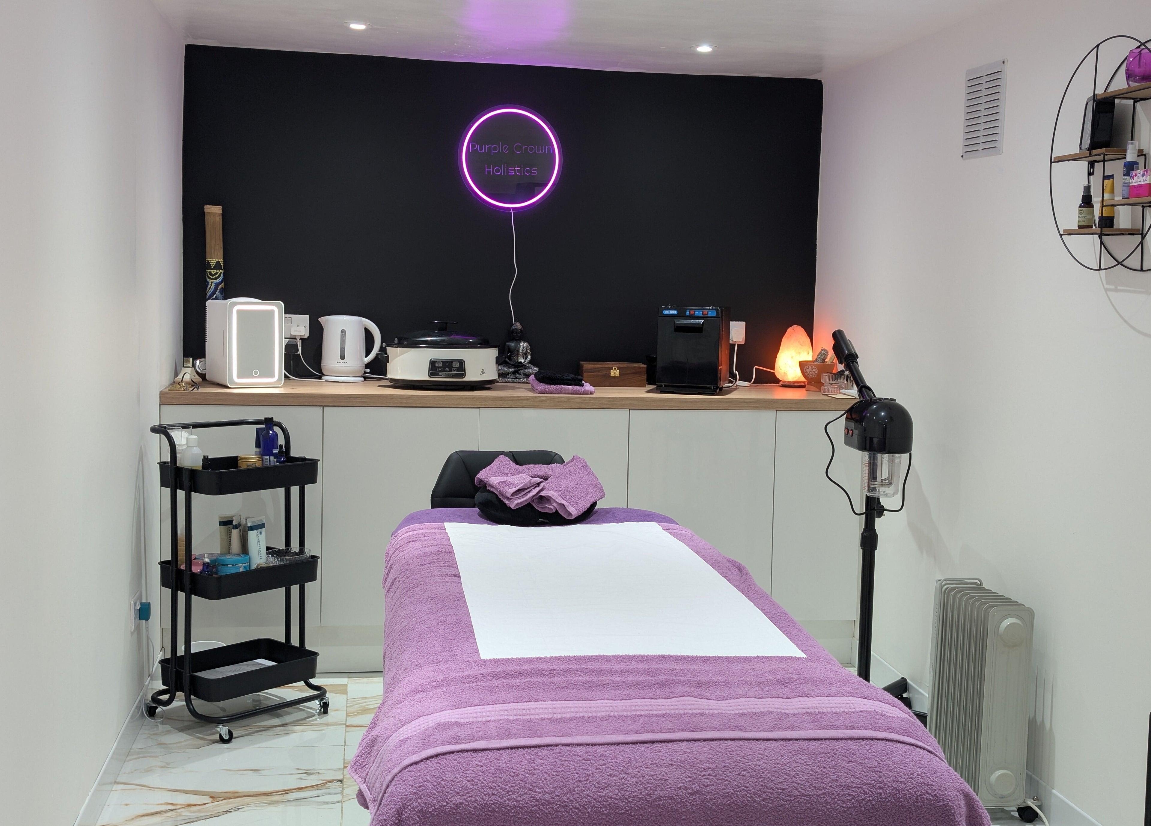 Therapy room at Purple Crown Holistics, Eston, England, GB, with a cozy bed and relaxing ambiance.