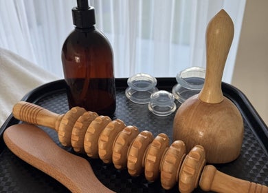 Wooden massage tools on a tray at Sculpt & Reset by H, Broxbourne, England, GB.