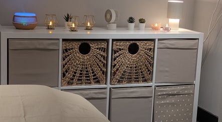 Cozy nook at Axiom Nature, London, England, GB with woven baskets, ambient lighting, and soothing decor.