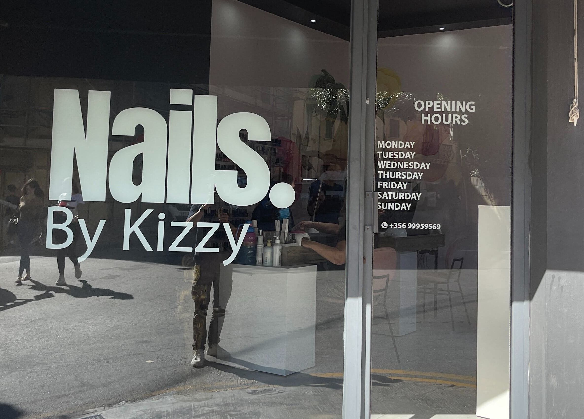 Nails by Kizzy, Tas-sliema, MT showcases its modern entrance with bold signage and opening hours.
