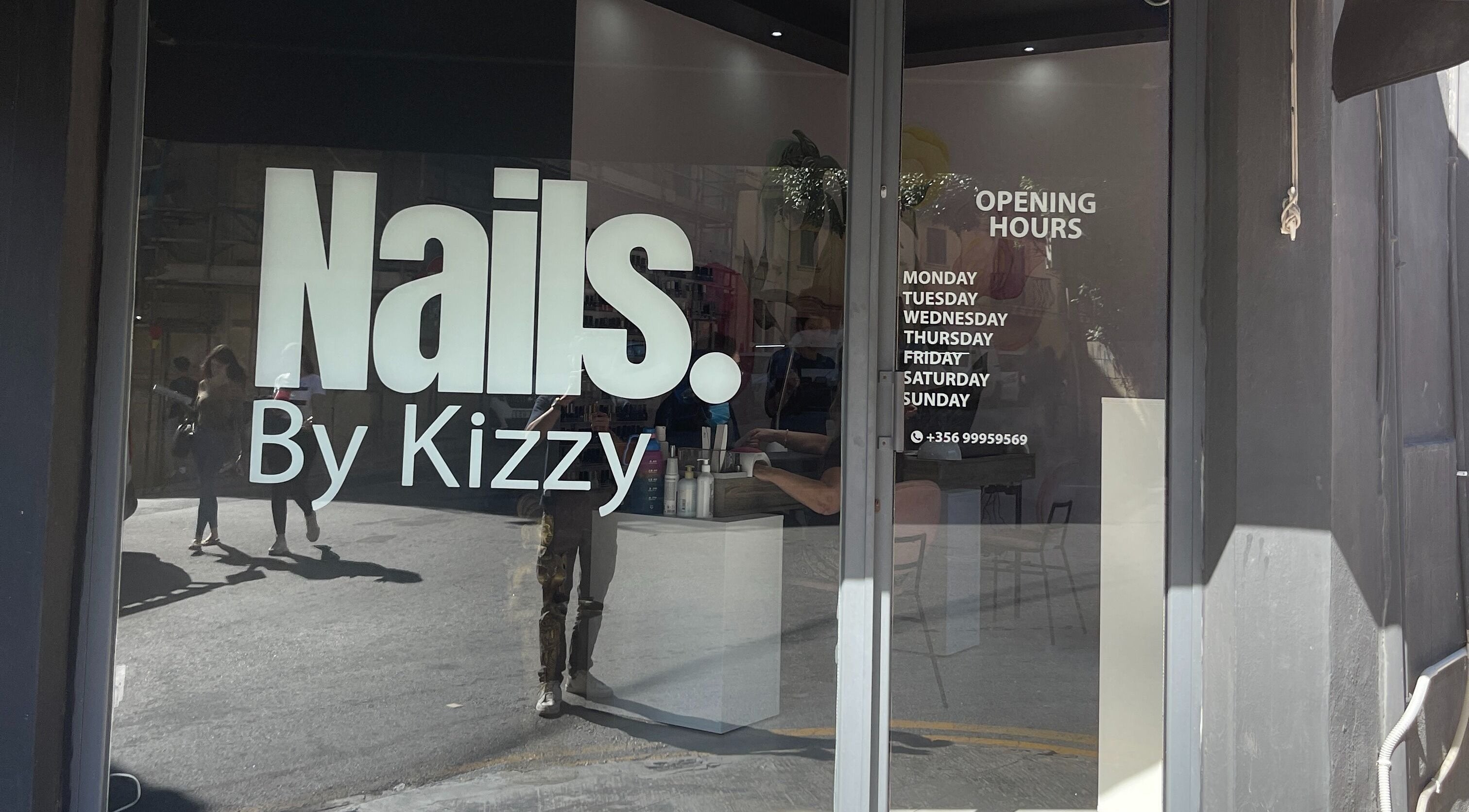 Nails by Kizzy, Tas-sliema, MT showcases its modern entrance with bold signage and opening hours.