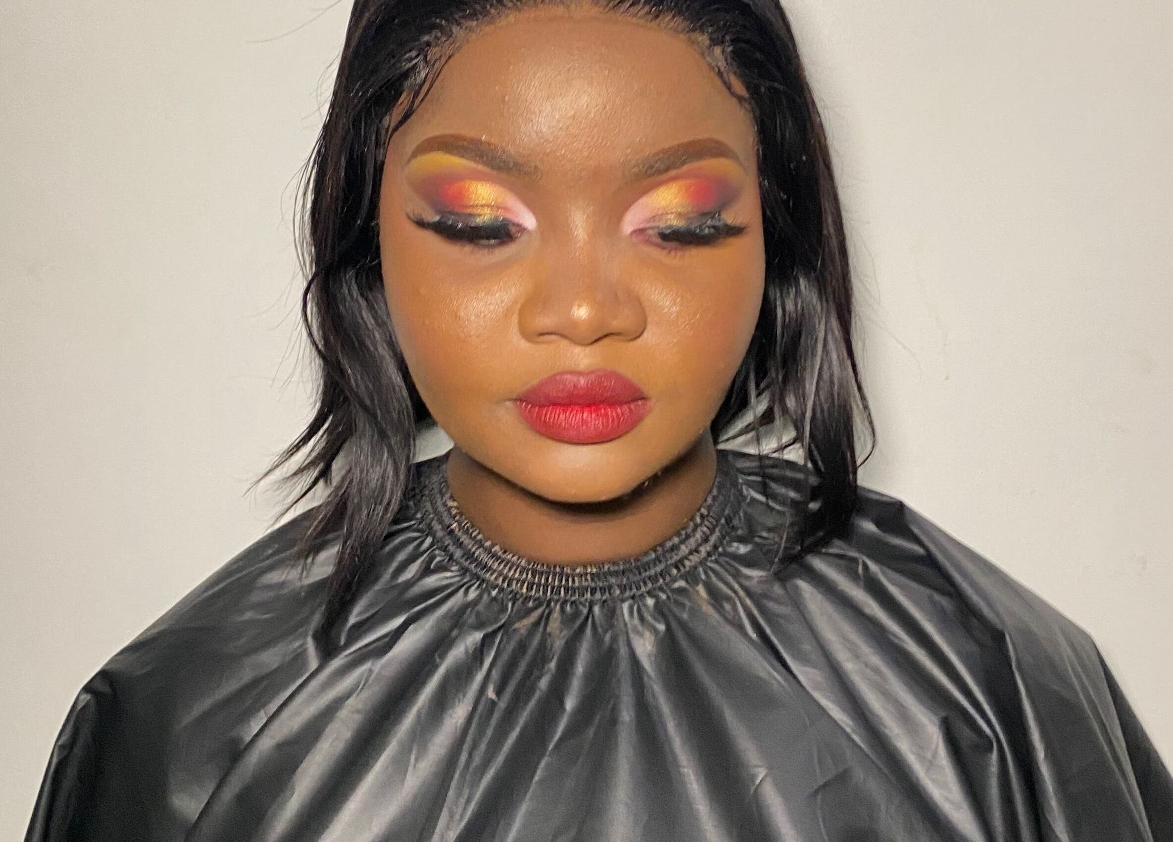 A vibrant makeup look at Diyasi’s beauty in Pretoria, Gauteng, ZA, showcasing bold eyes and lips.