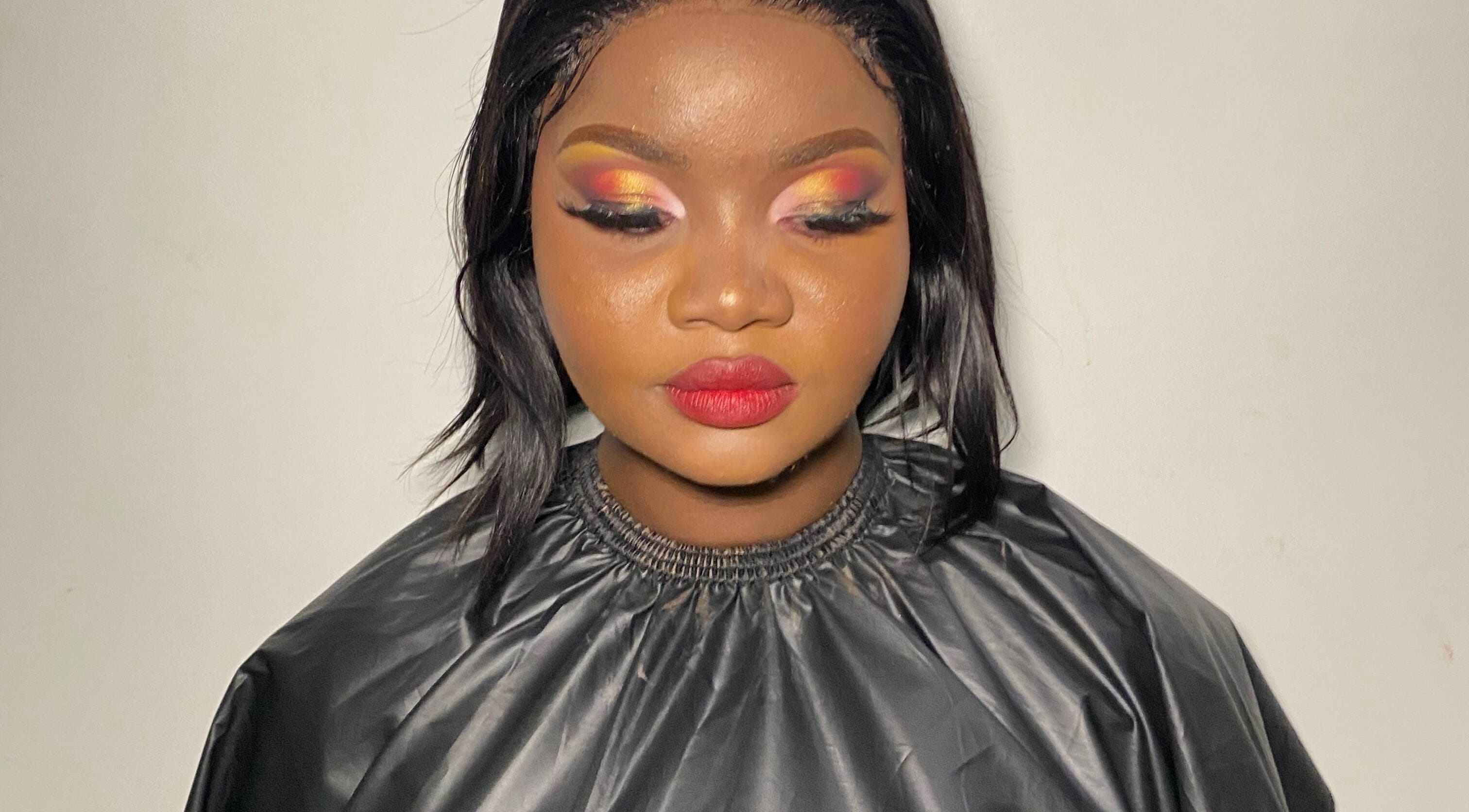 A vibrant makeup look at Diyasi’s beauty in Pretoria, Gauteng, ZA, showcasing bold eyes and lips.