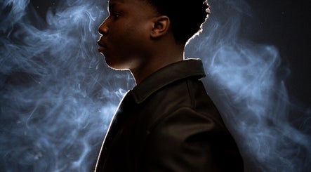 Profile silhouette against smoky background at Kyu the barber, Charlottetown, Prince Edward Island, CA.