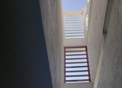 Stylish architectural view of SERELYS in Ecatepec De Morelos, Estado De México, MX with skyward angle.