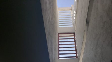 Stylish architectural view of SERELYS in Ecatepec De Morelos, Estado De México, MX with skyward angle.