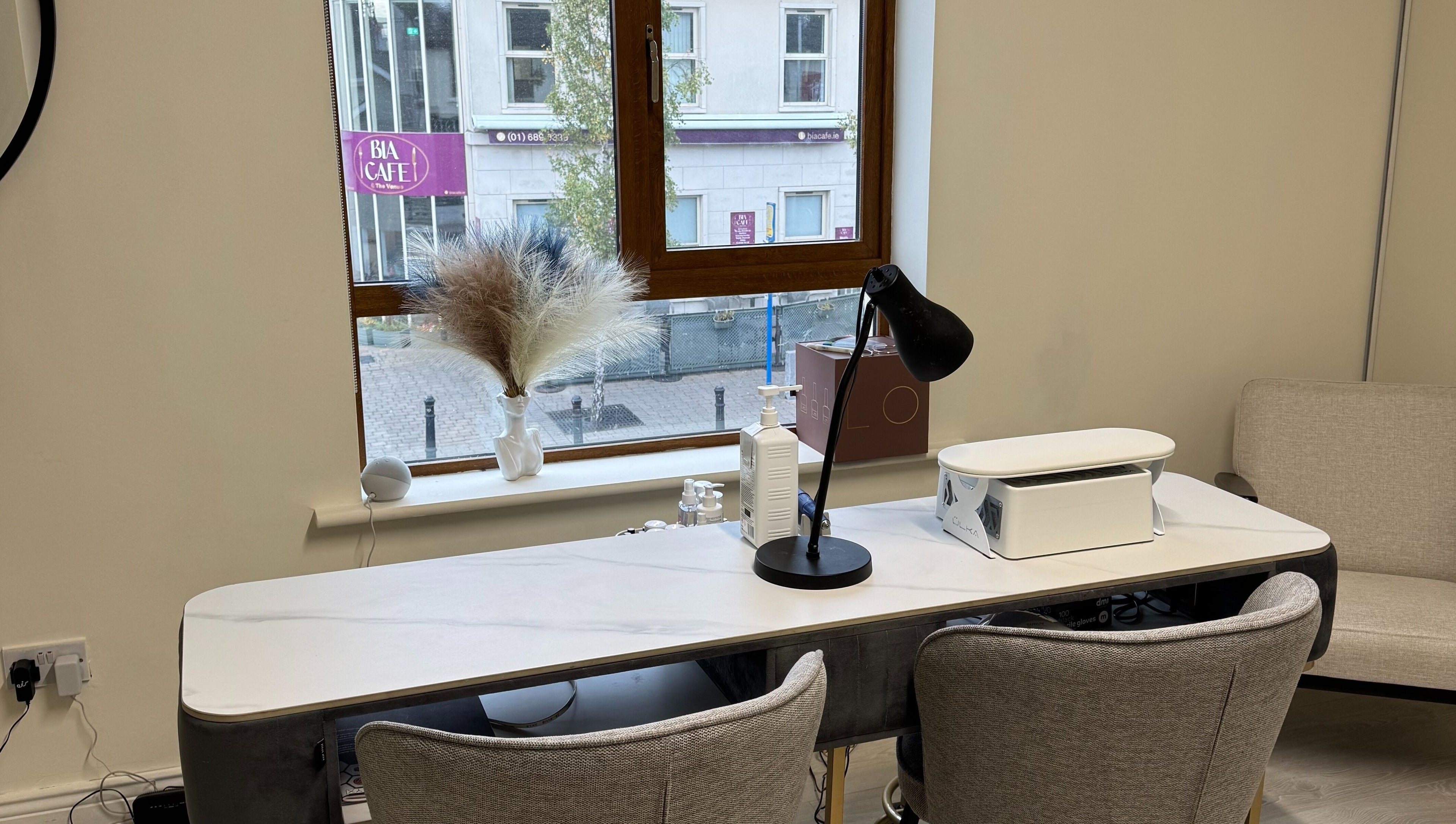 Modern manicure station at Solais Beauty Studio, Ratoath, IE with comfy chairs and stylish decor.