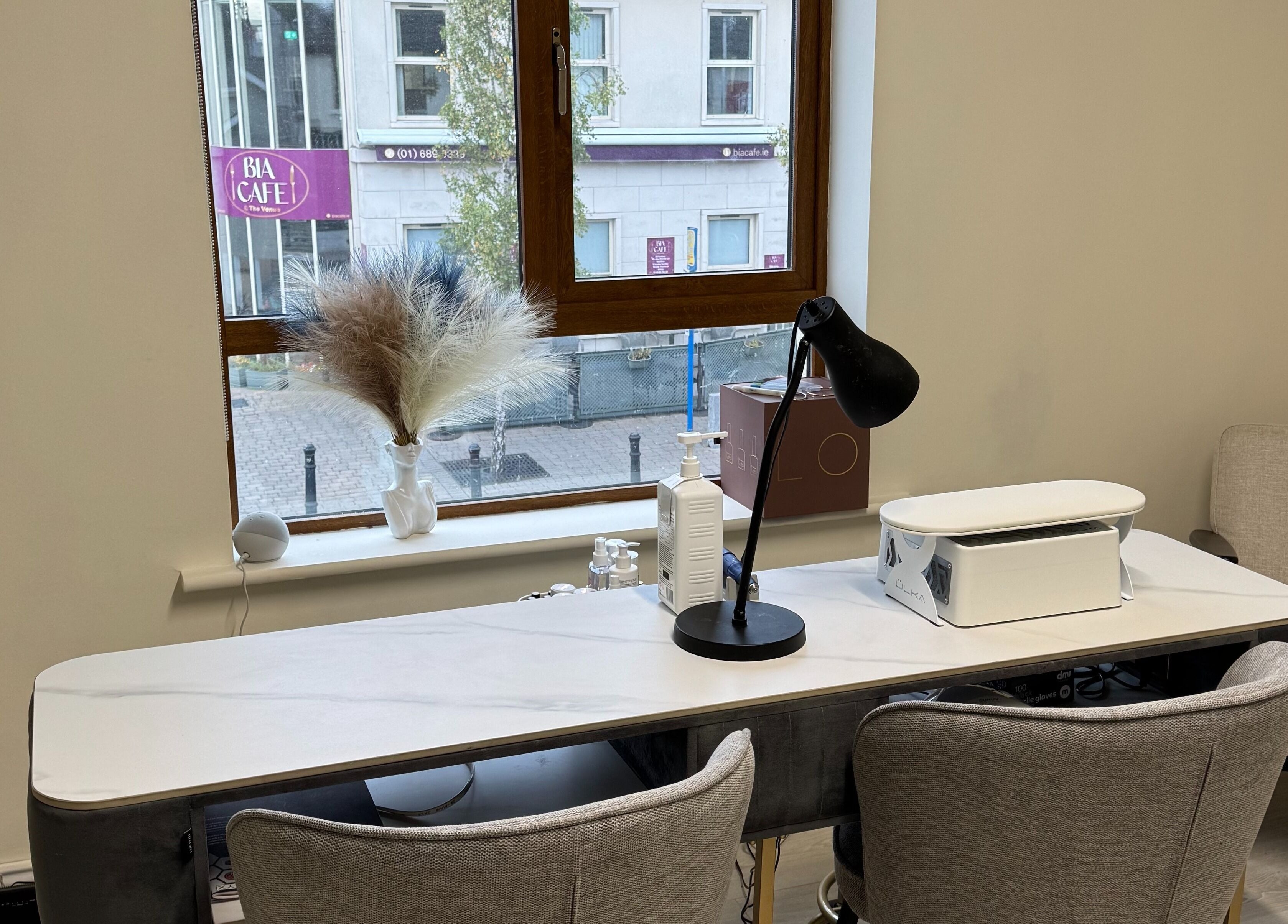 Modern manicure station at Solais Beauty Studio, Ratoath, IE with comfy chairs and stylish decor.