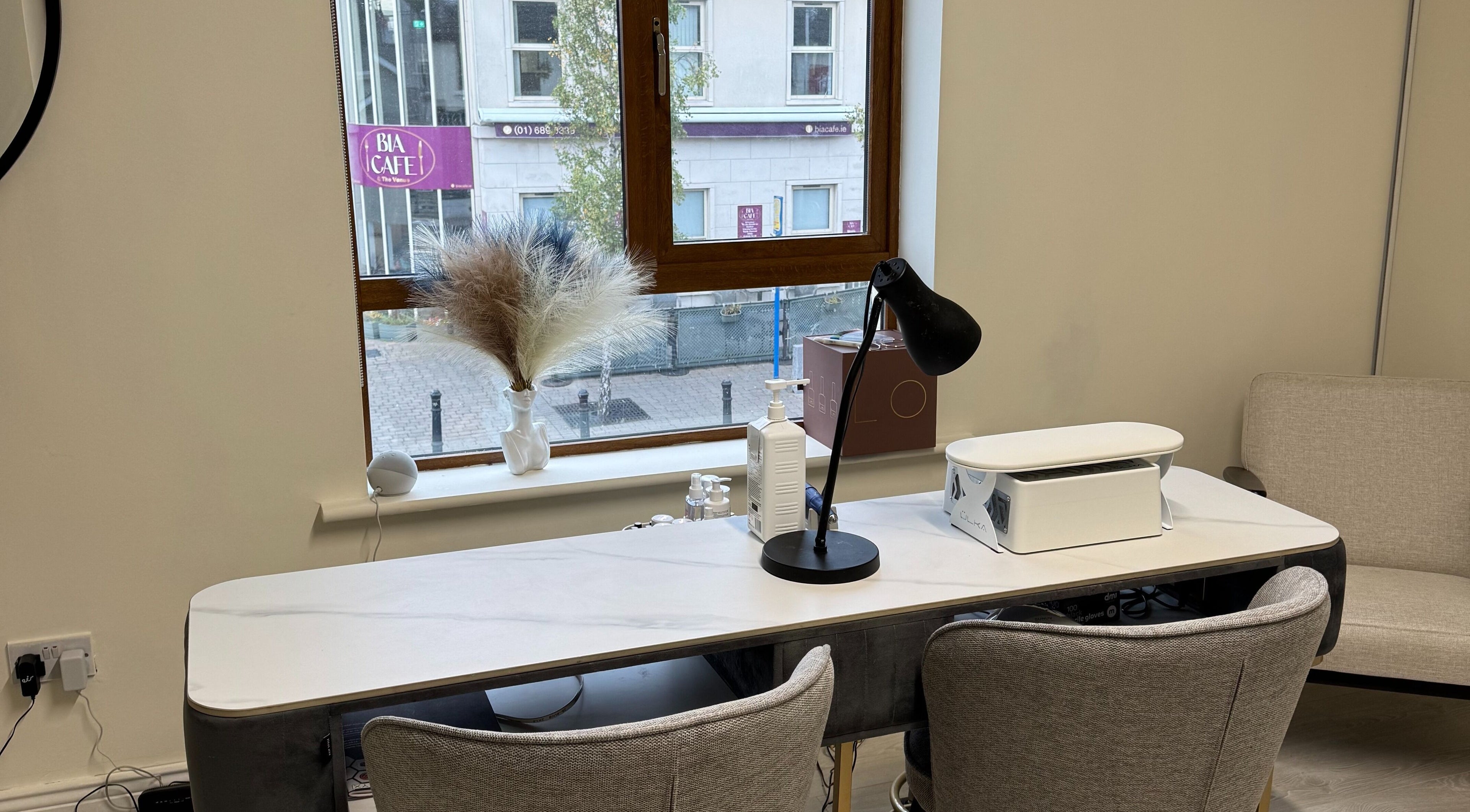 Modern manicure station at Solais Beauty Studio, Ratoath, IE with comfy chairs and stylish decor.