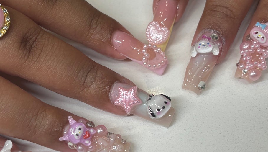 Intricate 3D nail art at Mid City Nails, Los Angeles, California, US, featuring cute character designs.