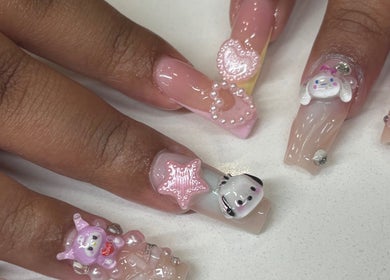 Intricate 3D nail art at Mid City Nails, Los Angeles, California, US, featuring cute character designs.