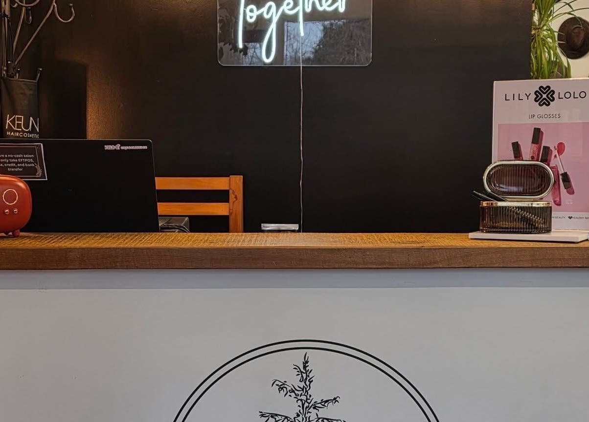 Stylish reception at Cedar Heights hair studio, Cust, Canterbury Region, NZ, featuring a modern counter and decor.