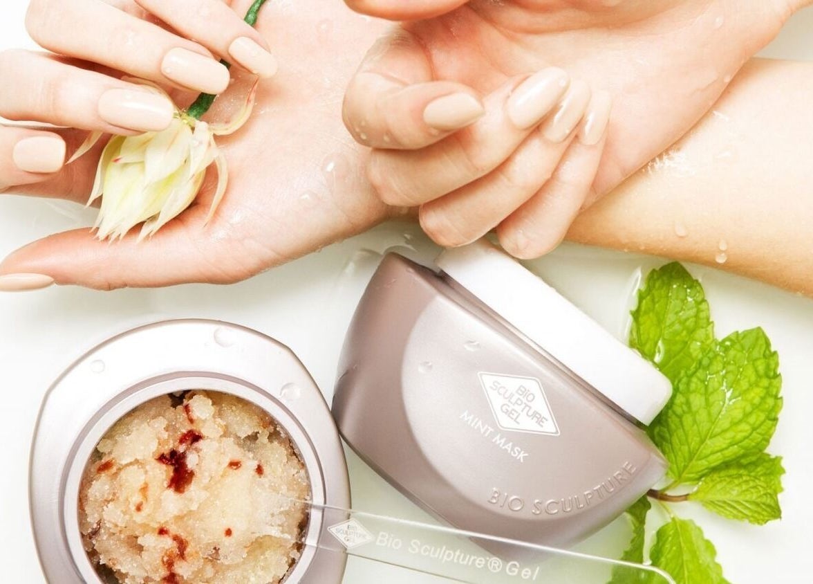 Luxurious hand treatment at Nicky's Beauty, Pretoria, Gauteng, ZA featuring soothing mint mask and floral touch.