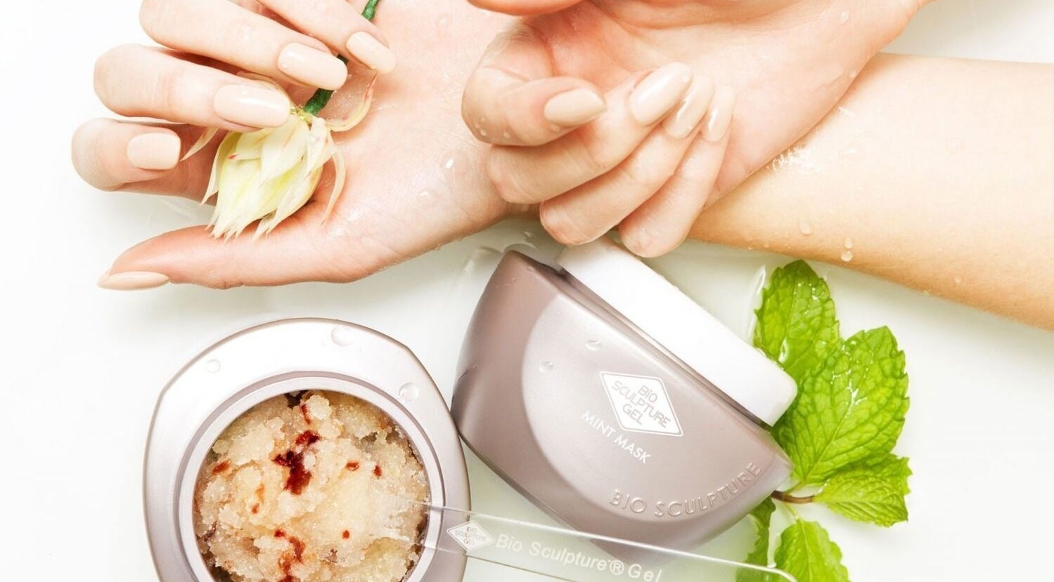 Luxurious hand treatment at Nicky's Beauty, Pretoria, Gauteng, ZA featuring soothing mint mask and floral touch.